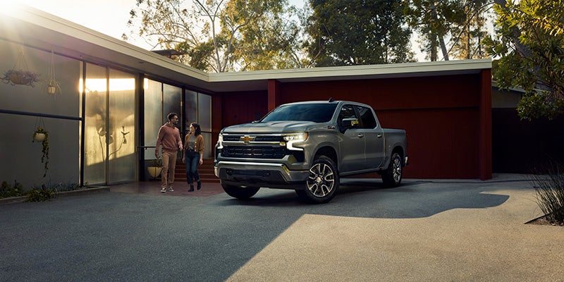 People standing beside Silverado-1500 ZR2 Img