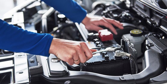 Technician working on an engine